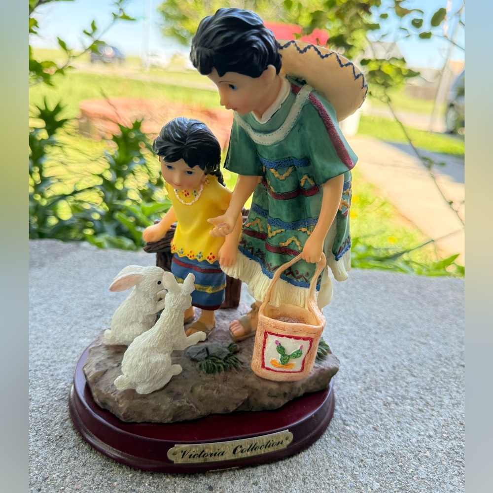 Colorful Figurine with Children and Rabbits